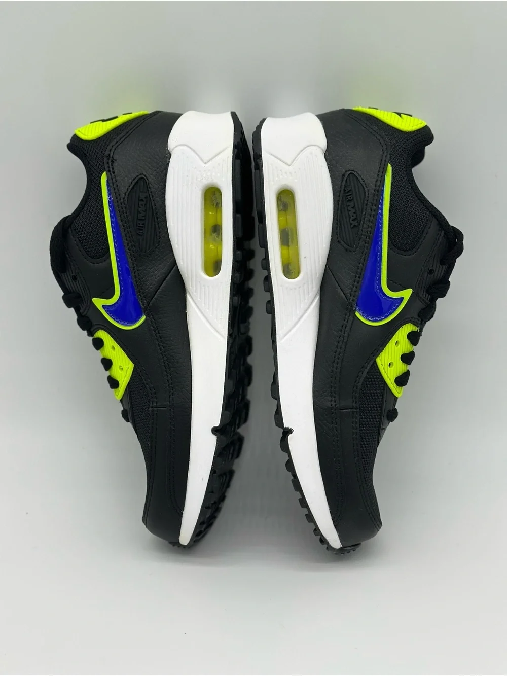 Nike Kids Black Sneakers with Neon Yellow and Blue Swoosh